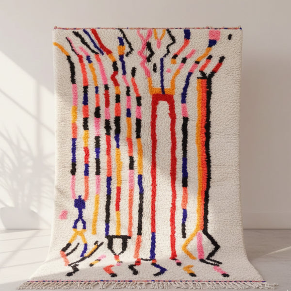 Add a burst of artistic energy to your home with a Handmade Azilal Moroccan Rug, a vibrant masterpiece that blends ancient Berber traditions with modern abstract expression.