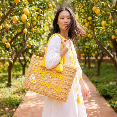 Handwoven Moroccan wicker beach tote with yellow braided handles and Easy Peasy Lemon Squeezy embroidered lemon design summer bag 4