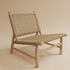 Embrace the authentic soul of North African design with this Handcrafted Moroccan Wood and Palm Leaf Chair.