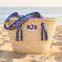 Handmade personalized Moroccan woven straw tote with blue patterned handles and custom initials 2