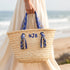 Handmade personalized Moroccan woven straw tote with blue patterned handles and custom initials 4