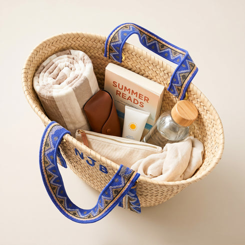Handmade personalized Moroccan woven straw tote with blue patterned handles and custom initials 3