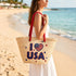 Handwoven straw beach tote with “I Love USA” embroidery and American flag heart, natural palm leaf basket with red rope handles, stylish patriotic travel and summer bag for women