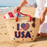 Handwoven straw beach tote with “I Love USA” embroidery and American flag heart, natural palm leaf basket with red rope handles, stylish patriotic travel and summer bag for women