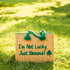 Handwoven Moroccan wicker beach bag with green braided handles embroidered with I’m Not Lucky Just Blessed and shamrock design 2