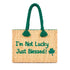 Handwoven Moroccan wicker beach bag with green braided handles embroidered with I’m Not Lucky Just Blessed and shamrock design