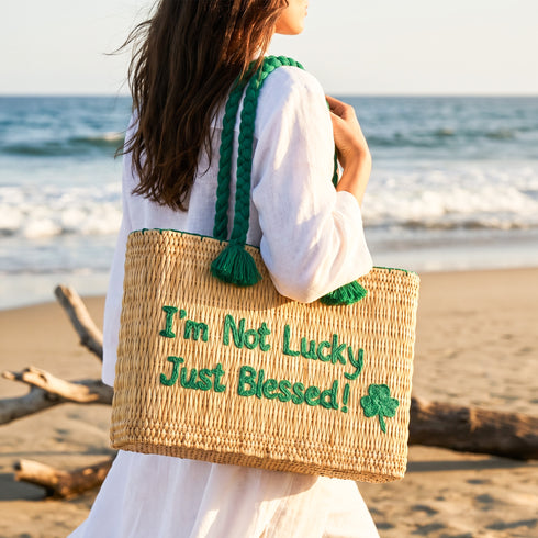 Handwoven Moroccan wicker beach bag with green braided handles embroidered with I’m Not Lucky Just Blessed and shamrock design 3