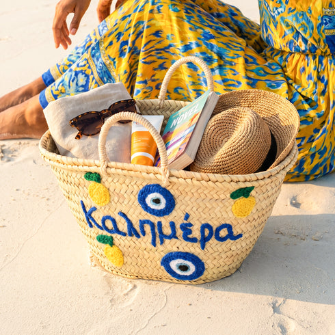 Medium Kalimera Greek straw beach bag with lemon embroidery and blue evil eye symbol, handmade Moroccan palm leaf basket tote for summer vacation and Mediterranean resort style