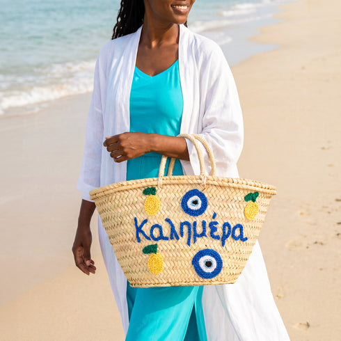 Medium Kalimera Greek straw beach bag with lemon embroidery and blue evil eye symbol, handmade Moroccan palm leaf basket tote for summer vacation and Mediterranean resort style