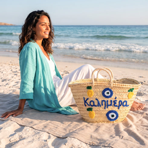 Medium Kalimera Greek straw beach bag with lemon embroidery and blue evil eye symbol, handmade Moroccan palm leaf basket tote for summer vacation and Mediterranean resort style