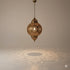 Ideal for use in an entryway, living room, or over a dining table, this authentic Moroccan piece is more than just a light source