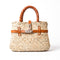 Small luxury Hermès-inspired straw handbag with braided leather handles and secure closure 1