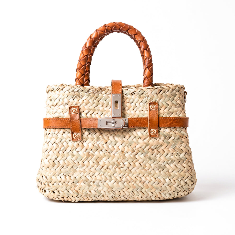Small luxury Hermès-inspired straw handbag with braided leather handles and secure closure 1
