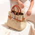 Small luxury Hermès-inspired straw handbag with braided leather handles and secure closure 5