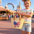 Personalized USA kids straw basket with embroidered American flag bow, small handwoven palm leaf tote with leather handles, custom name on back, patriotic children’s beach and birthday gift bag