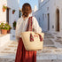 Personalized Moroccan woven straw beach tote with red Amazigh patterned handles and custom initials 3
