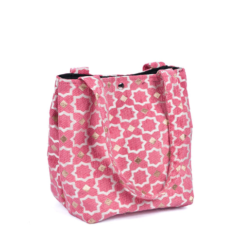 Pink Moroccan shoulder bag with traditional geometric brocade motifs ,made from durable linen with comfortable handles and lightweight design
