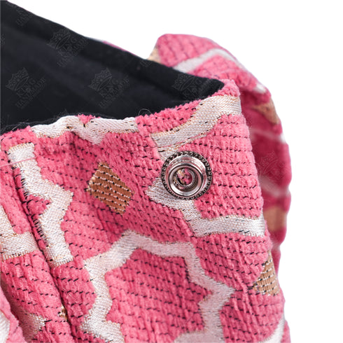 Pink Moroccan shoulder bag with traditional geometric brocade motifs ,made from durable linen with comfortable handles and lightweight design