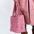 Pink Moroccan shoulder bag with traditional geometric brocade motifs ,made from durable linen with comfortable handles and lightweight design