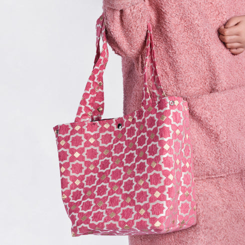 Pink Moroccan shoulder bag with traditional geometric brocade motifs ,made from durable linen with comfortable handles and lightweight design