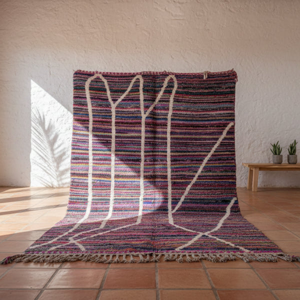 Add a dynamic splash of personality to your interior with a Striped Colorful Moroccan Rug, a perfect fusion of heritage and contemporary flair.