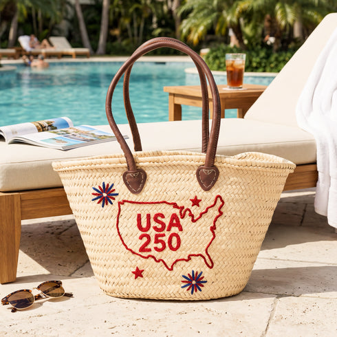 USA patriotic straw basket with red embroidered USA map and leather handles, handmade palm leaf beach tote bag for travel, summer events and 4th of July celebrations