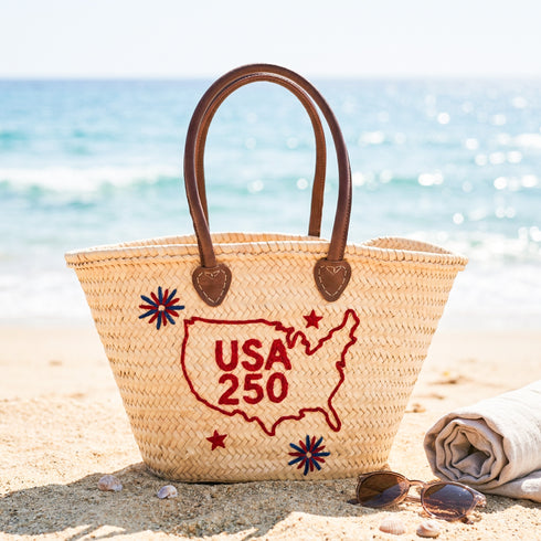 USA patriotic straw basket with red embroidered USA map and leather handles, handmade palm leaf beach tote bag for travel, summer events and 4th of July celebrations