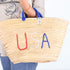 straw basket embroidered with “USA” Eco-friendly tote with blue handle—perfect for beach days, shopping, or patriotic gifts.