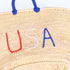 straw basket embroidered with “USA” Eco-friendly tote with blue handle—perfect for beach days, shopping, or patriotic gifts.