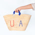 straw basket embroidered with “USA” Eco-friendly tote with blue handle—perfect for beach days, shopping, or patriotic gifts.