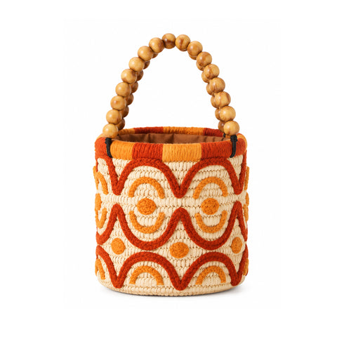 Handmade raffia bucket bag with wooden bead handle and orange-red embroidery, made in Morocco