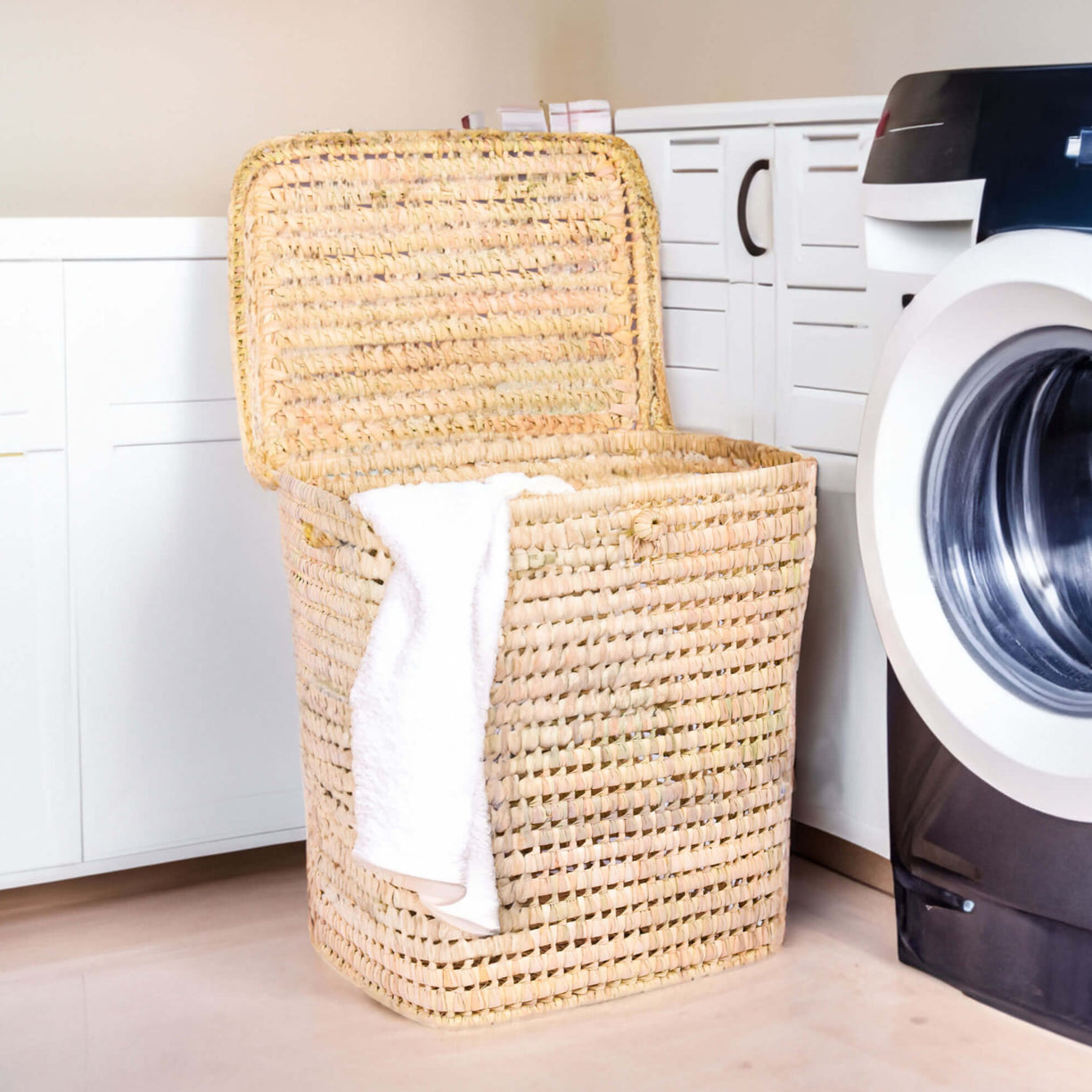 Boho nursery storage basket with handles, showcasing versatile and chic woven toy storage