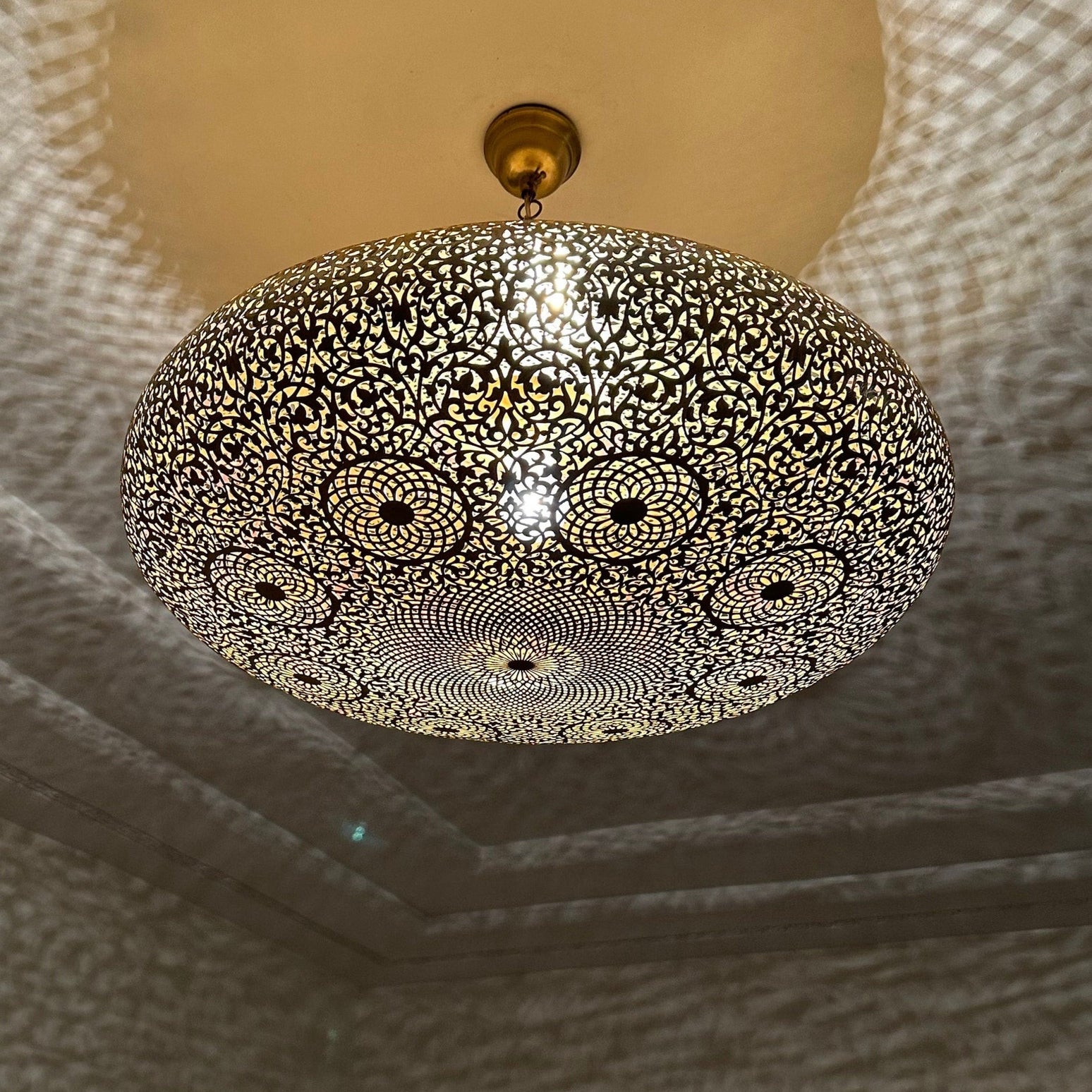 Intricate Moroccan brass chandelier with detailed metalwork