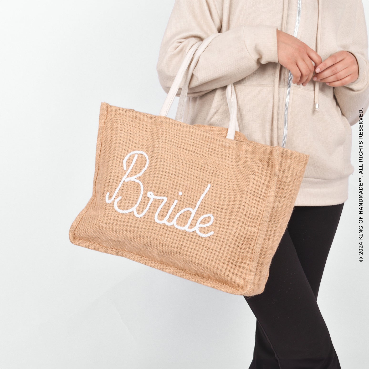 Stylish jute tote bag with 'Bride' text, perfect for beach outings