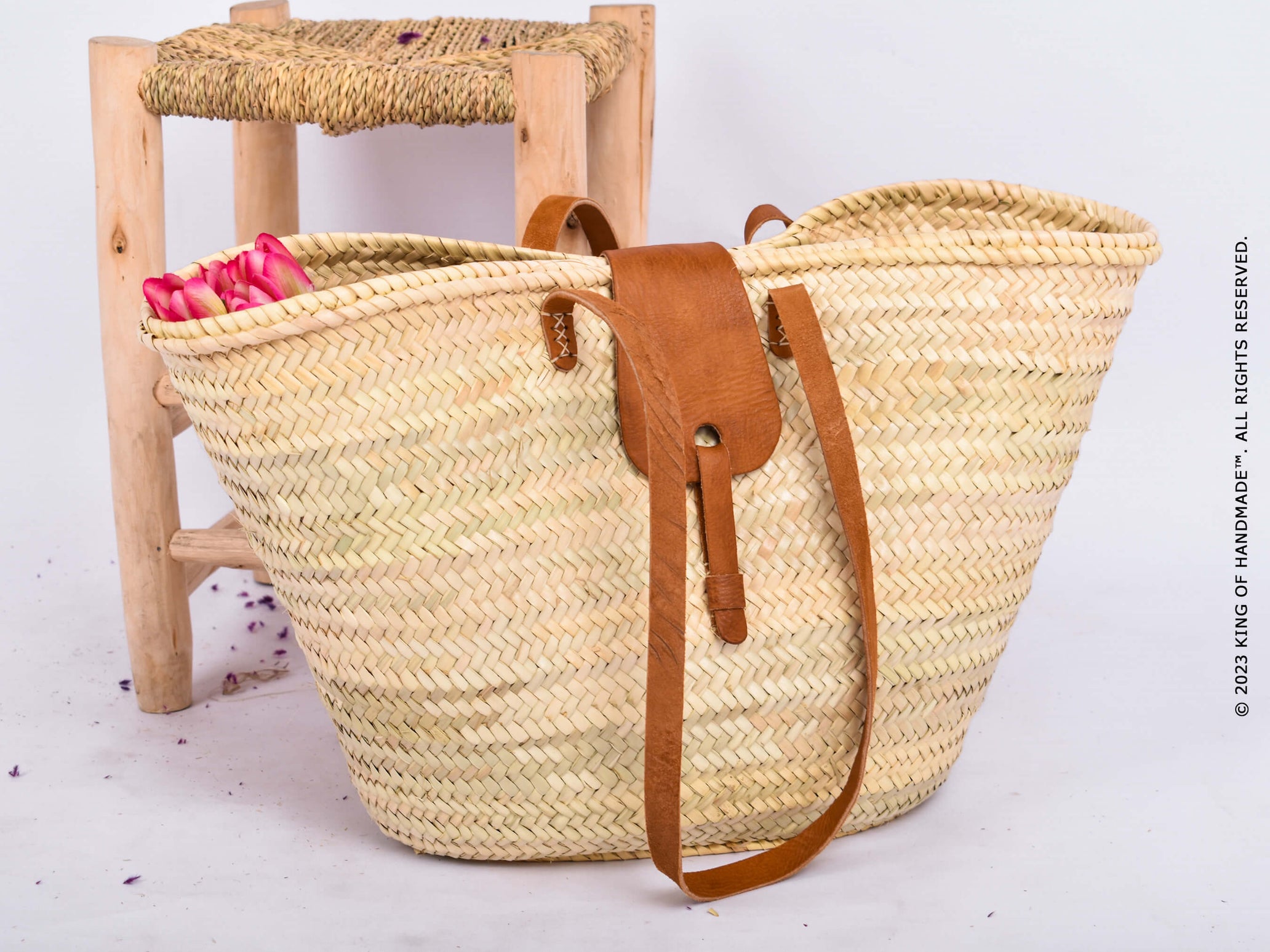 Large straw beach bag showcasing traditional Moroccan weaving techniques