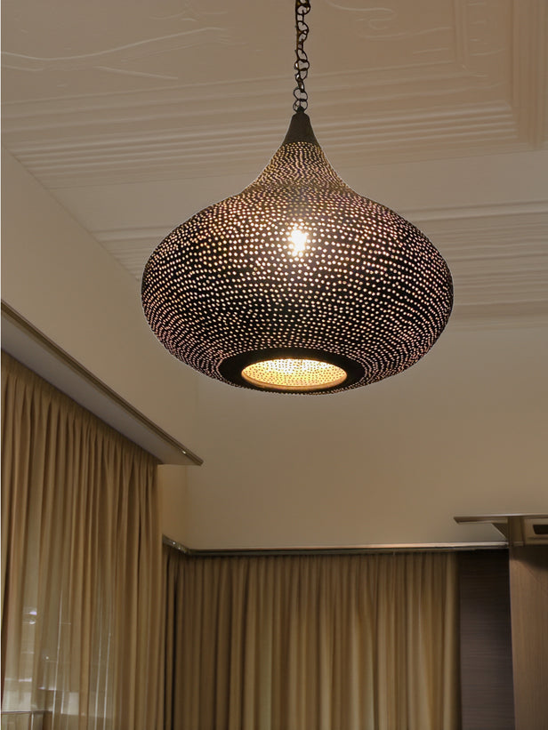 Close up of a black moroccan light fixture with intricate patterns