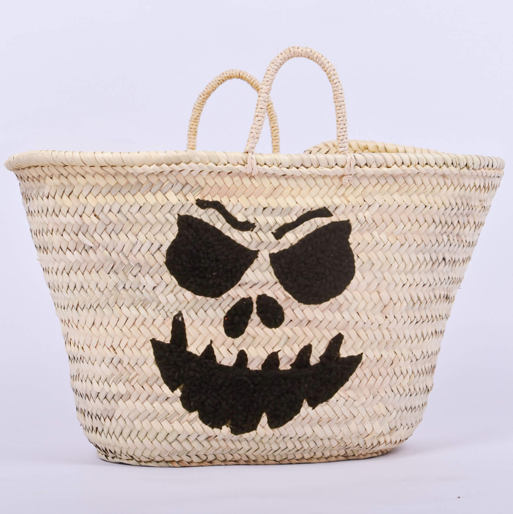 Personalized straw basket with your child's name for Halloween.