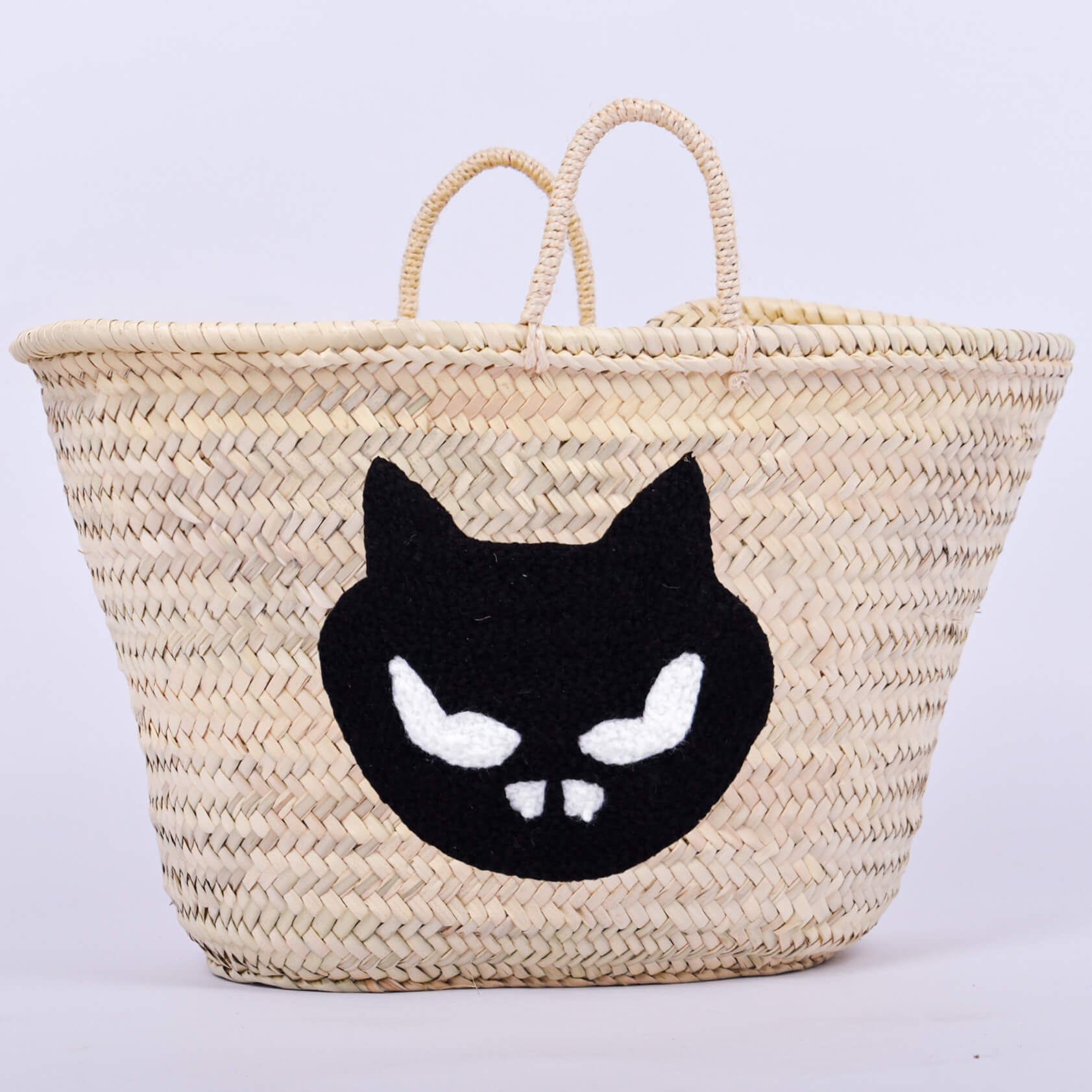 Personalized straw basket with your child's name for Halloween.