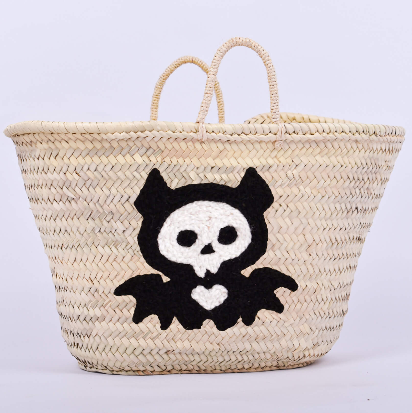 Personalized straw basket with your child's name for Halloween.