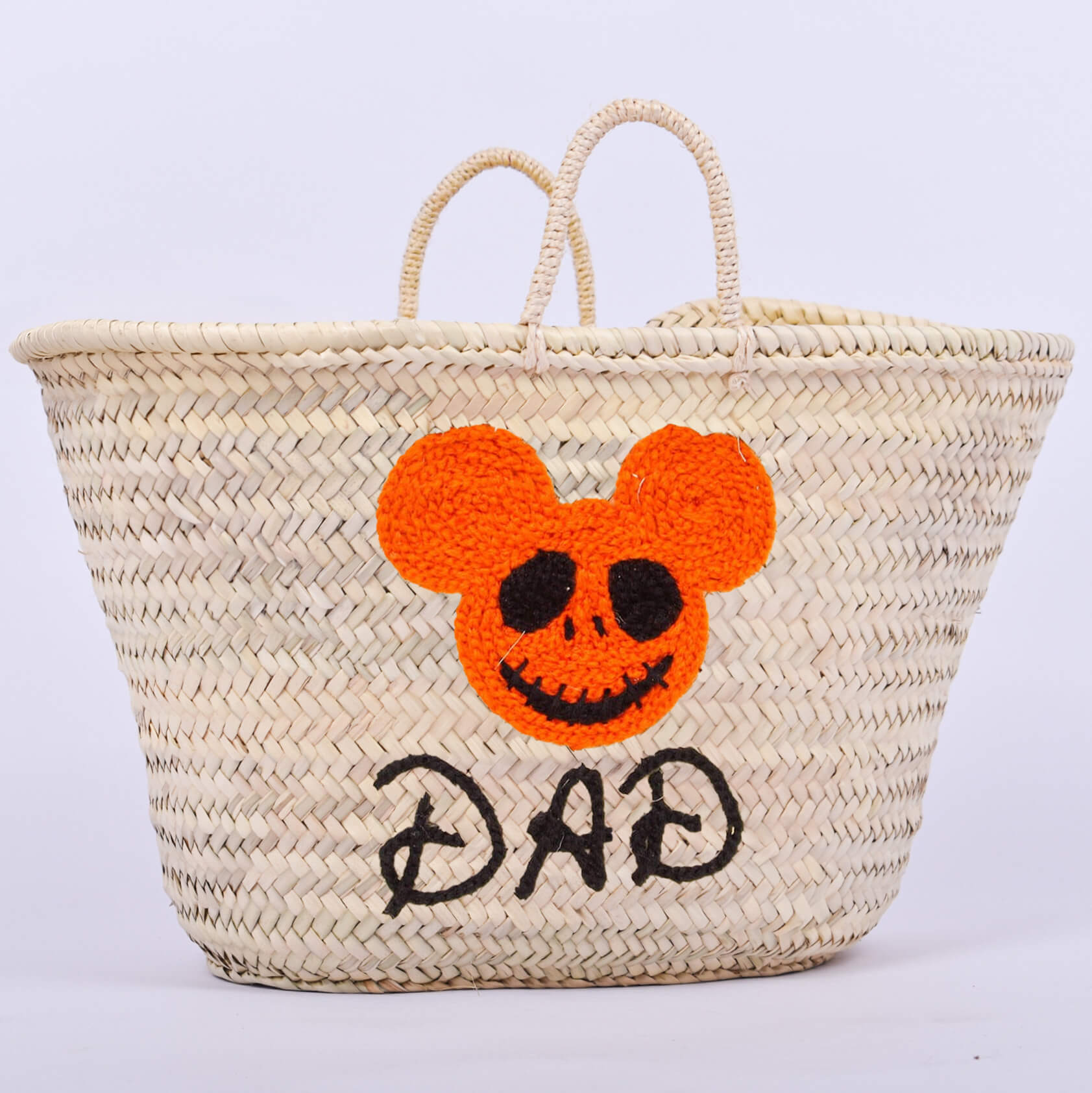 Personalized straw basket with your child's name for Halloween.