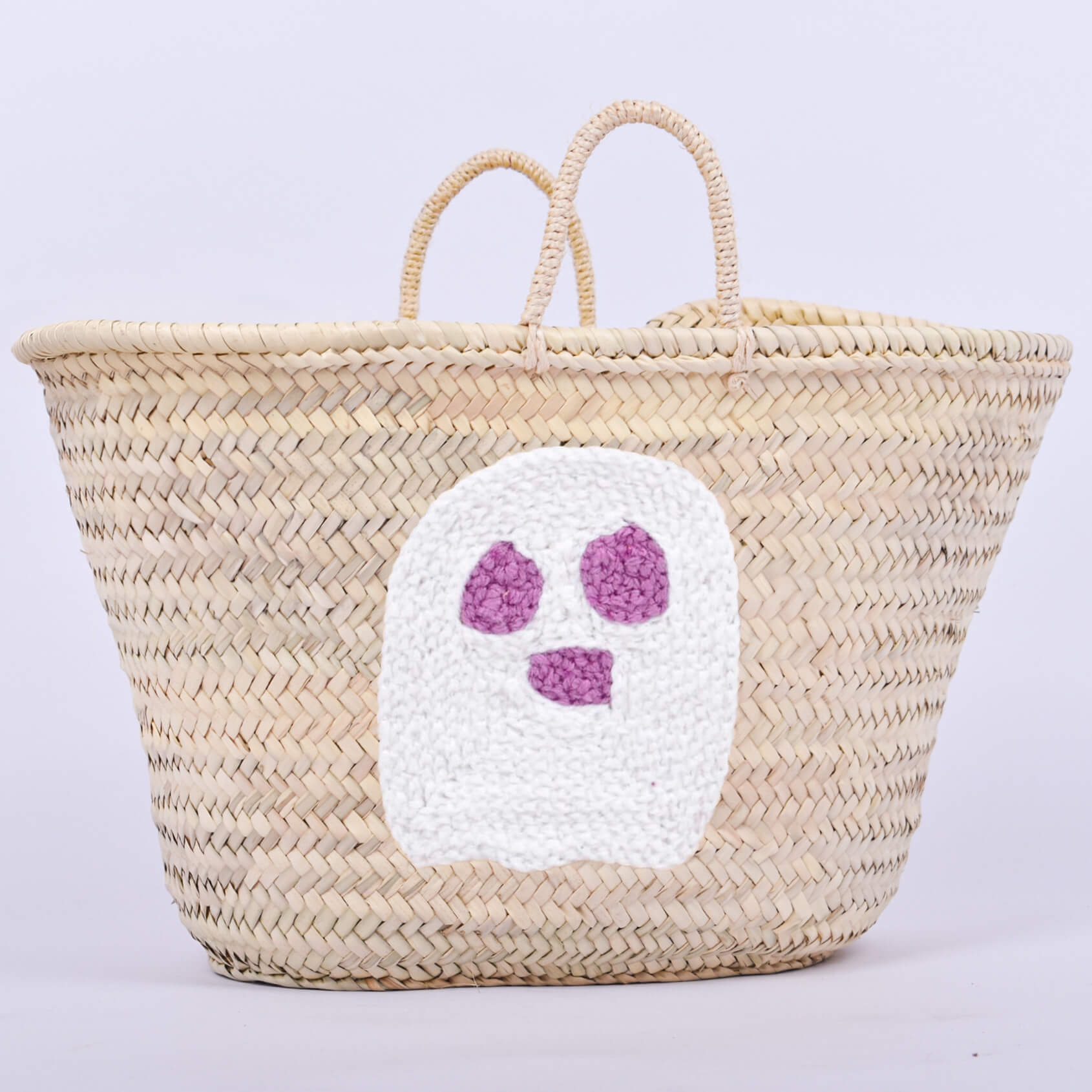 Personalized straw basket with your child's name for Halloween.