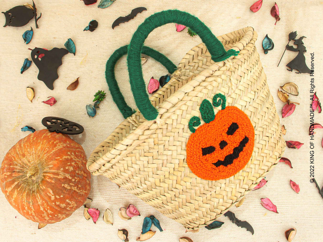 Colorful pumpkin-shaped Halloween baskets with personalized designs