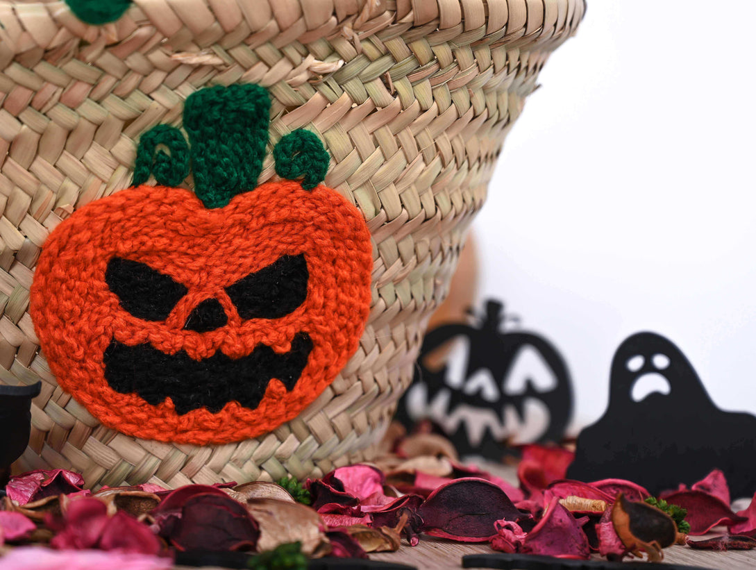 Pumpkin basket filled with colorful autumn flowers