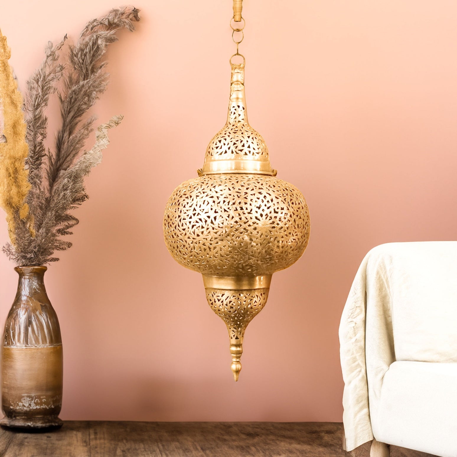 Ornate Moroccan lamp casting intricate shadows on a wall