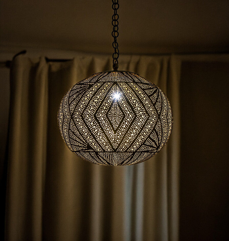 A stunning midcentury-style black chandelier with a starburst design and globe bulbs.