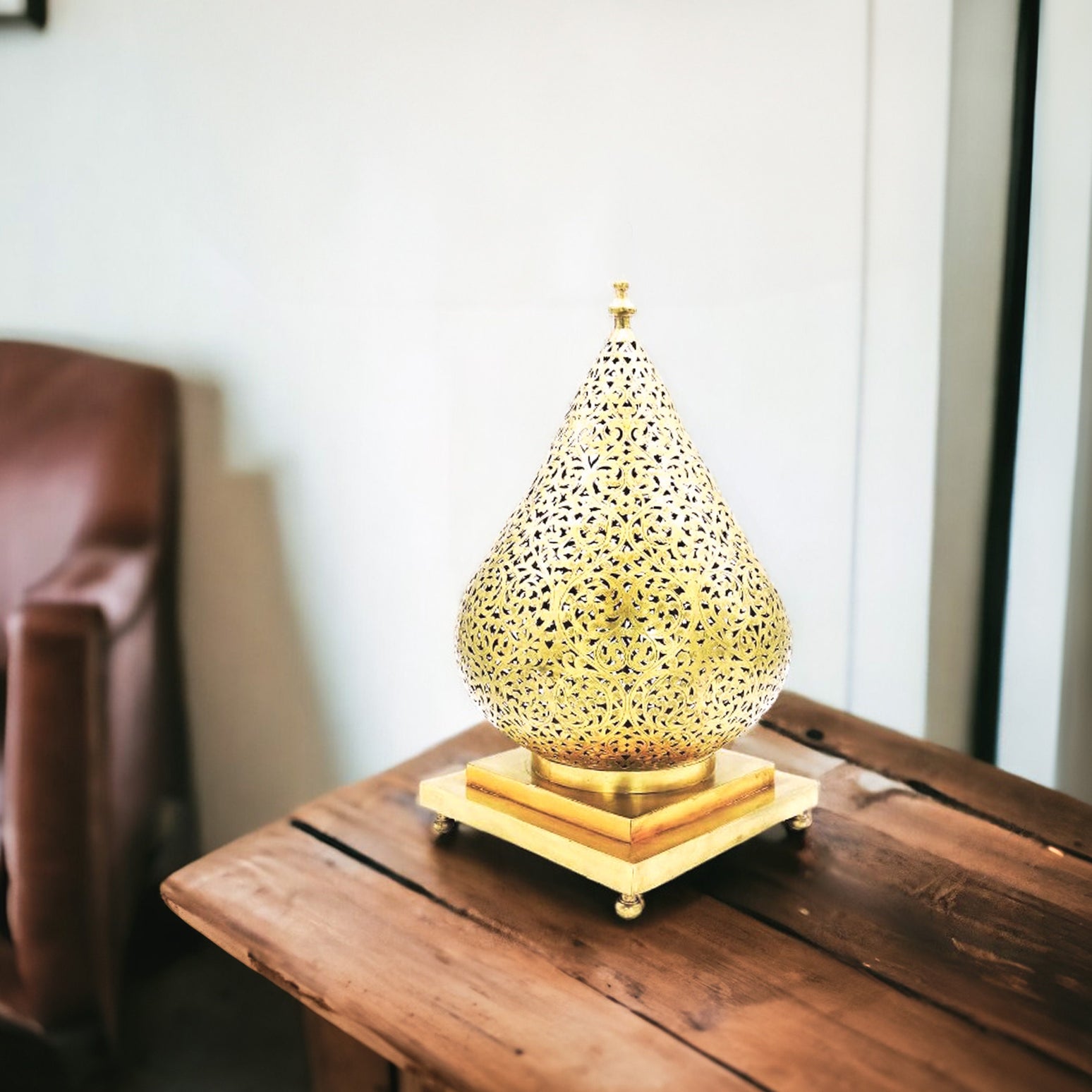 Elegant Moroccan brass chandelier casting intricate shadows