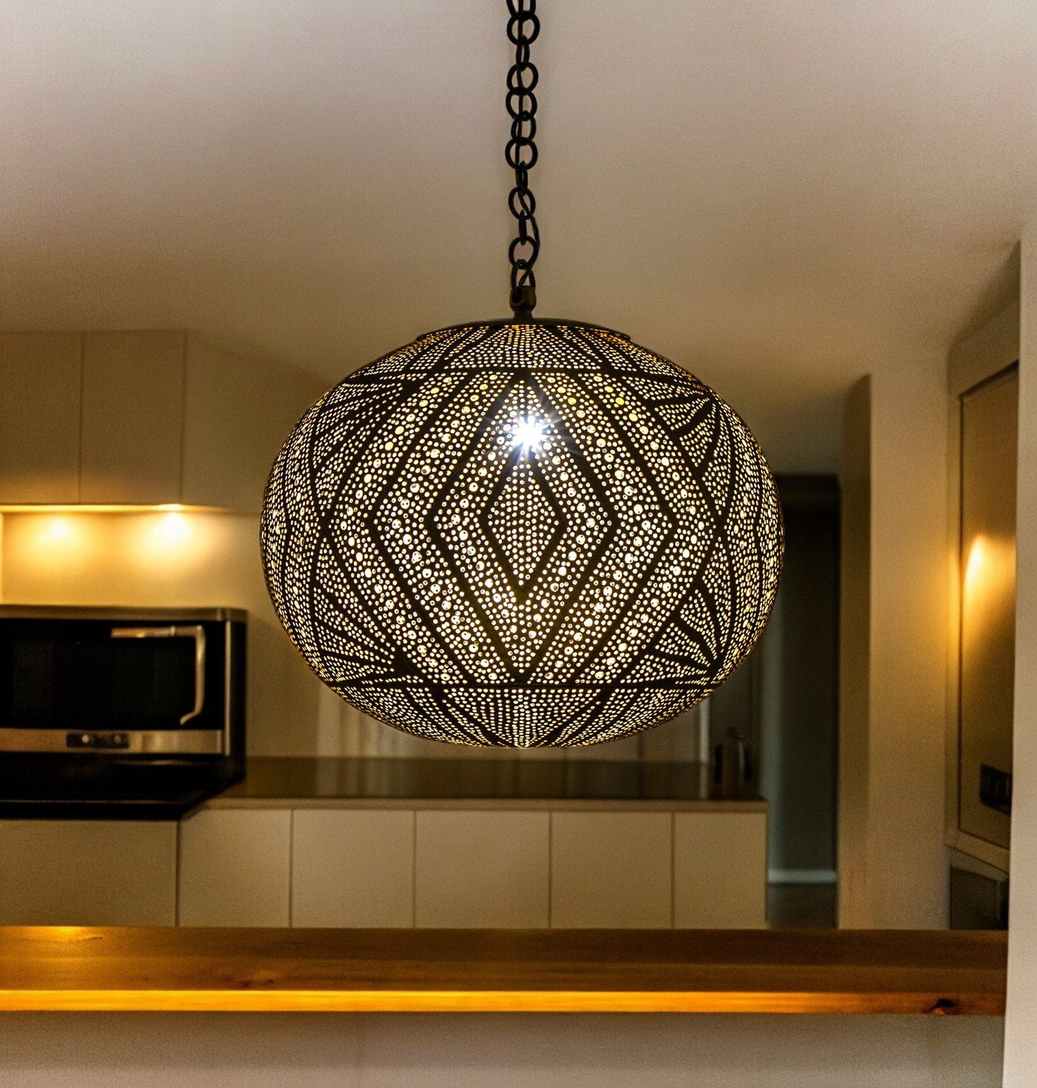 Stylish Moroccan-inspired pendant light creating ambiance in a modern kitchen