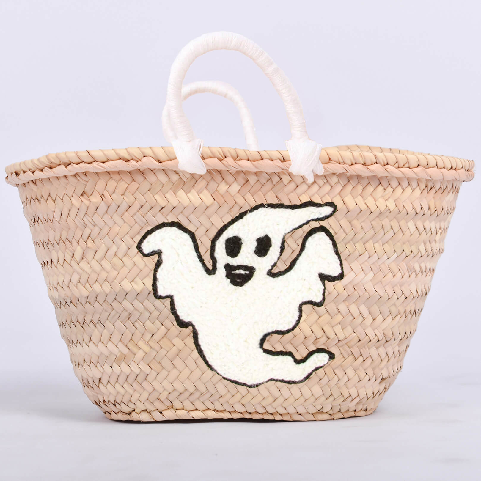 Personalized straw basket with your child's name for Halloween.