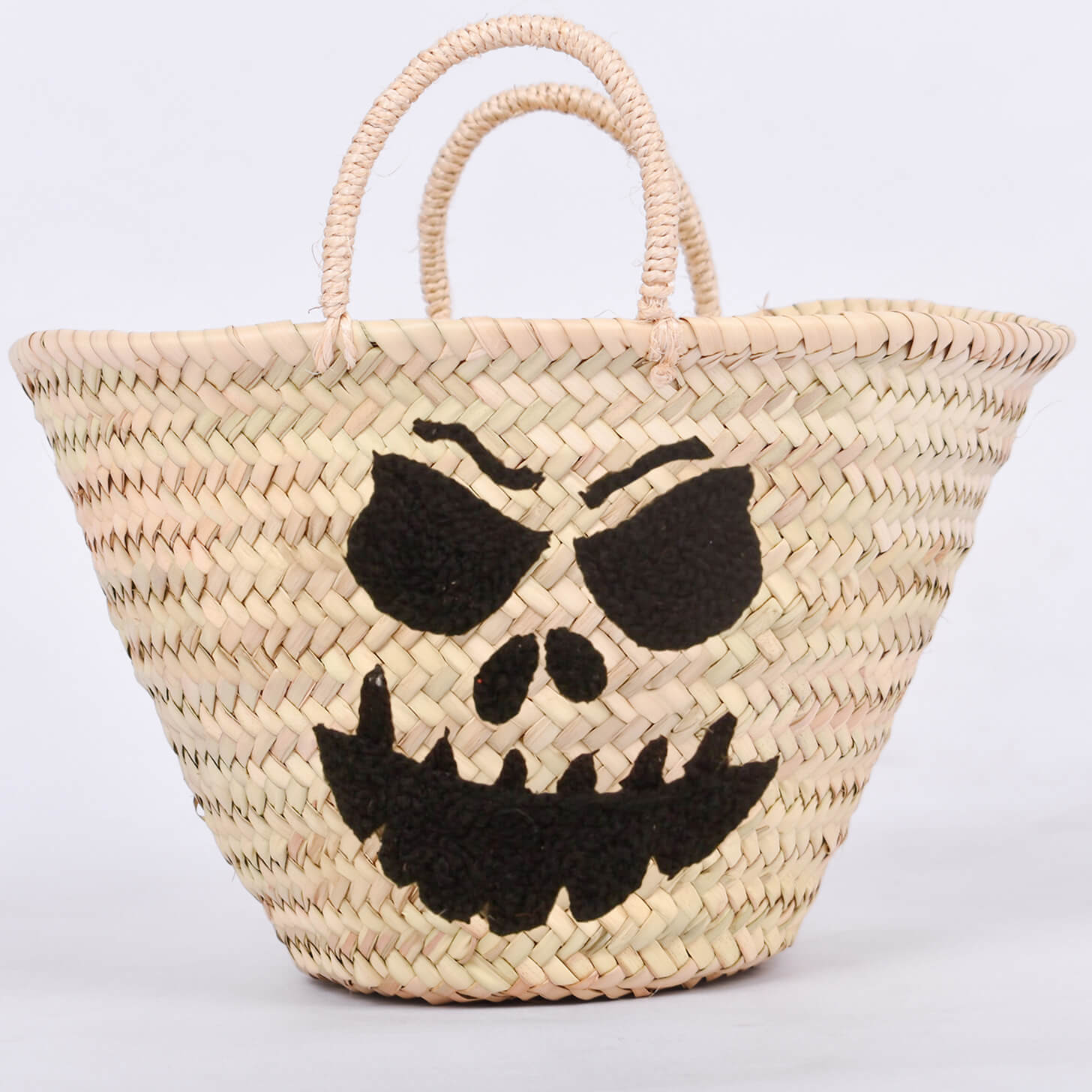 Personalized straw basket with your child's name for Halloween.