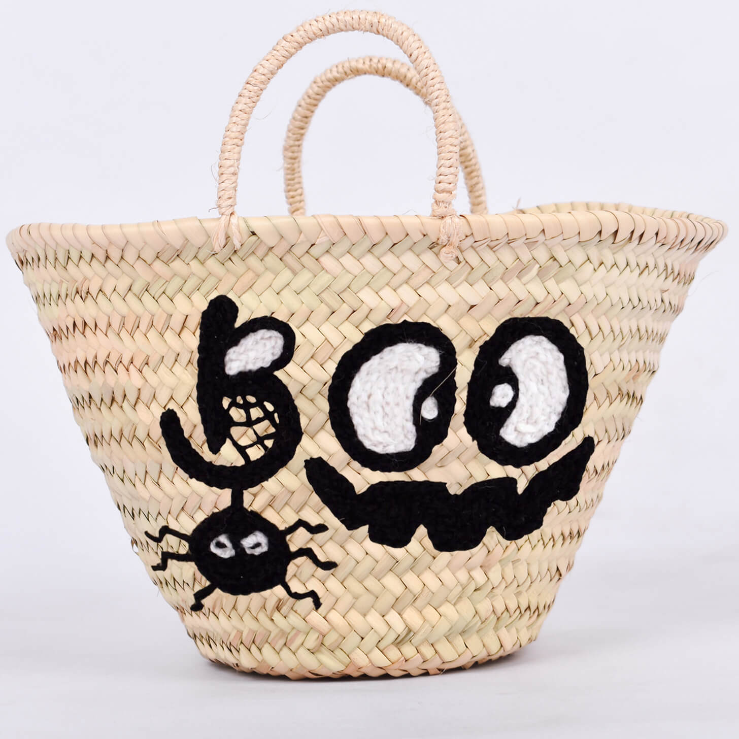 Personalized straw basket with your child's name for Halloween.